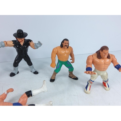 206 - Box of wrestlers and action figures including Ghostbuster characters, He-Man & Battle Cat, The Simps... 