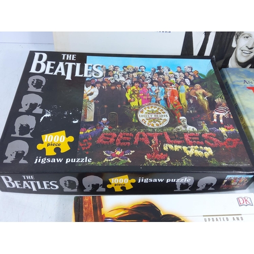 212 - Various books including World of Warcraft and the Beatles and a Beatles puzzle