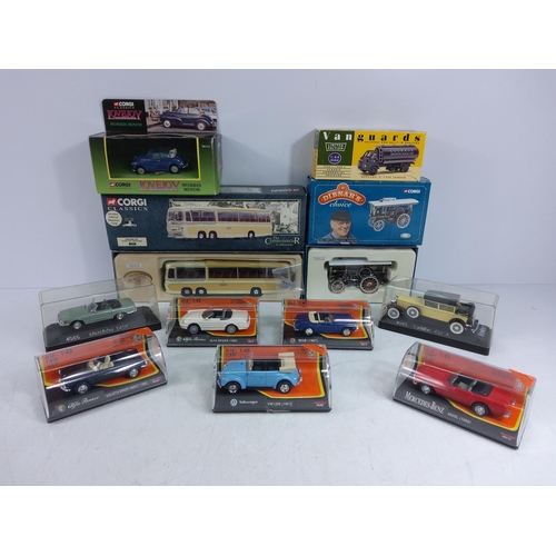 126 - Collection of 11 boxed and cased model vehicles