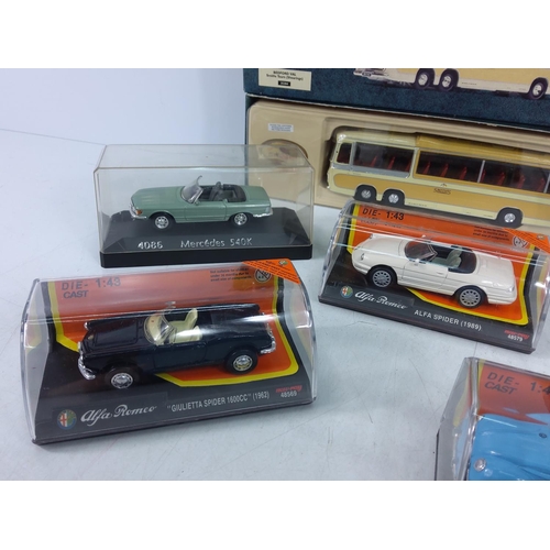 126 - Collection of 11 boxed and cased model vehicles