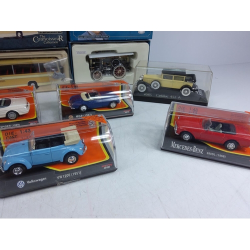 126 - Collection of 11 boxed and cased model vehicles