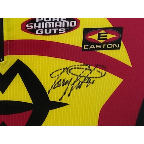 110 - Mounted Gary Fisher racing jersey signed, 102 x 84cms