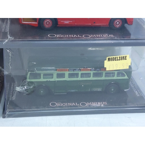 153 - 10 boxed Corgi buses