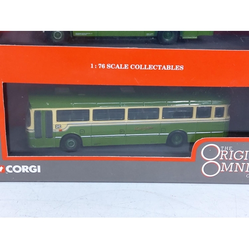 153 - 10 boxed Corgi buses