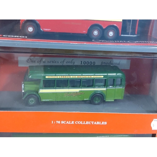 153 - 10 boxed Corgi buses