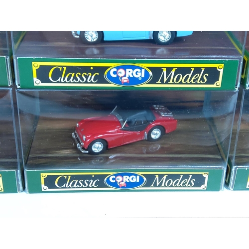 57 - Corgi wooden display plinth with boxed model vehicles