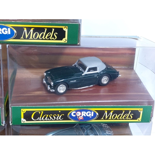 57 - Corgi wooden display plinth with boxed model vehicles