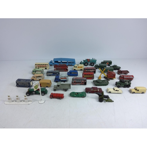 66 - Tin of various vintage model vehicles including military