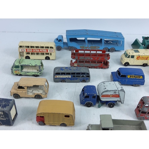 66 - Tin of various vintage model vehicles including military