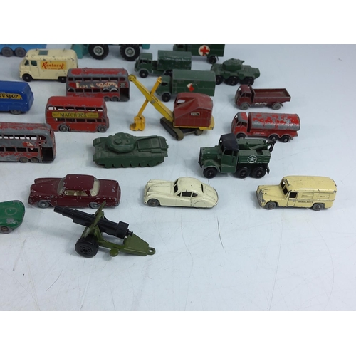 66 - Tin of various vintage model vehicles including military