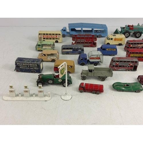 66 - Tin of various vintage model vehicles including military