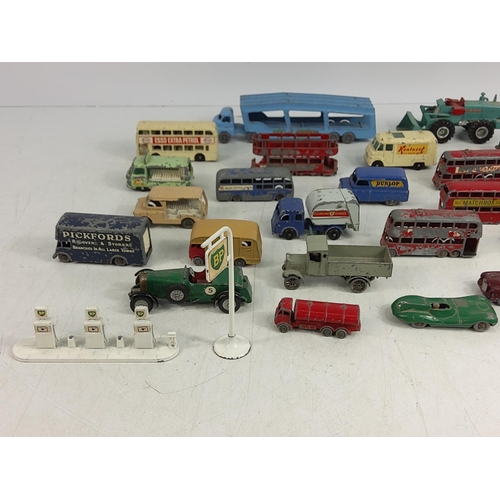 66 - Tin of various vintage model vehicles including military