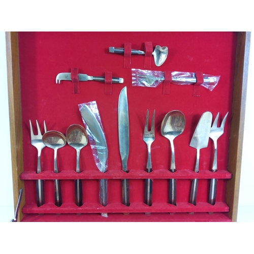 102 - Cased bronze canteen of cutlery