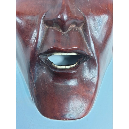 127 - Carved hardwood oriental Noh Japanese theatre mask, 32 x 16cms