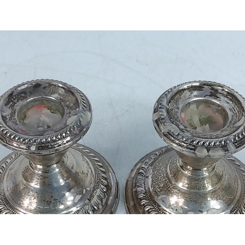 299 - Pair of weighted silver candle sticks, 276g gross