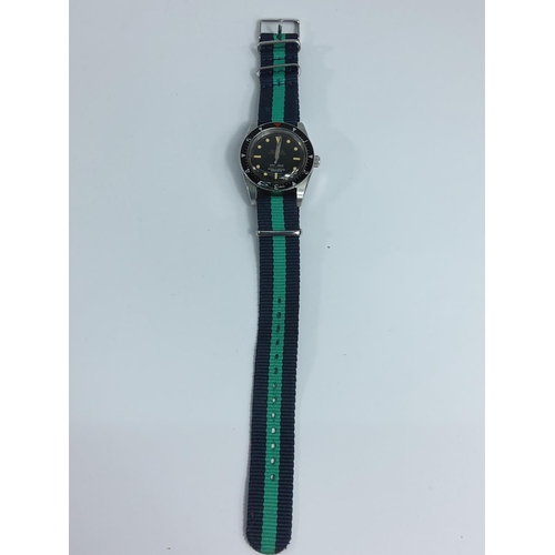 321 - Gents wrist watch with canvas strap (no particular brand)