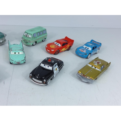 67 - Qty of model vehicles from Disney's film cars, 2 Lightening McQueen and 1 Dinaco Lightening Mc Queen... 