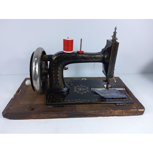 166 - Wooden cased sewing machine