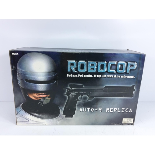 112 - Boxed Robocop gun and boxed Marvel Magneto (Magneto AF)