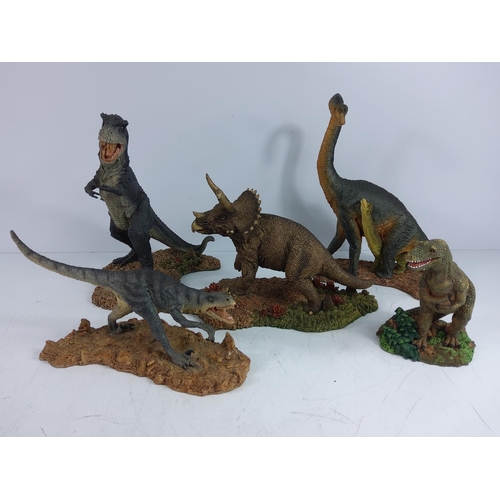 131 - 4 Jurassic Giants dinosaur figures and one other