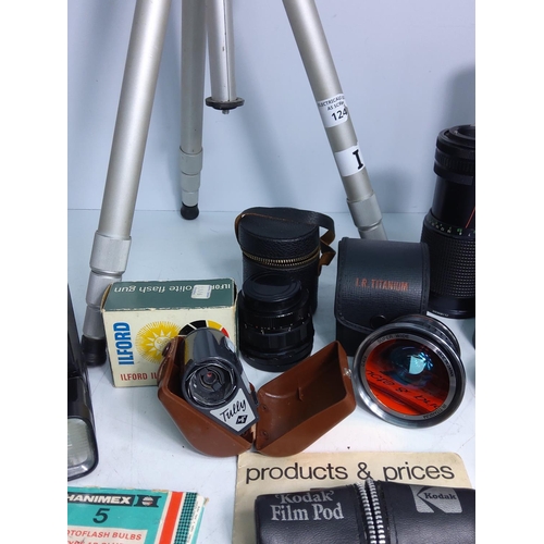 34 - Camera lens, accessories and tripod