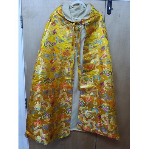 83 - Oriental dragon decorated cape