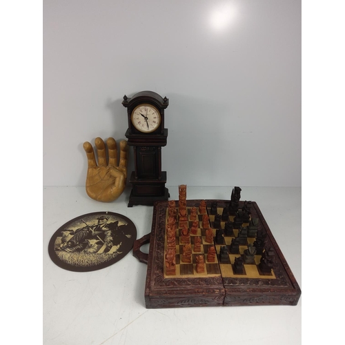 182 - Chess board and pieces, wooden hand, plaque and clock