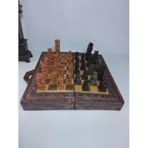 182 - Chess board and pieces, wooden hand, plaque and clock