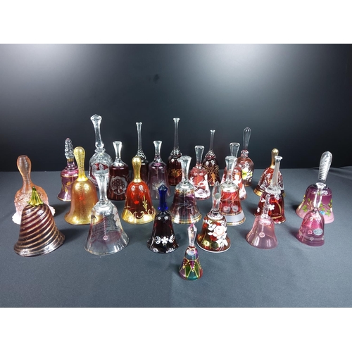 83 - Glass and coloured glass bells including Mary Gregory and ruby and cranberry examples