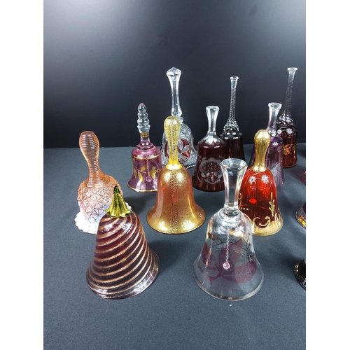 83 - Glass and coloured glass bells including Mary Gregory and ruby and cranberry examples