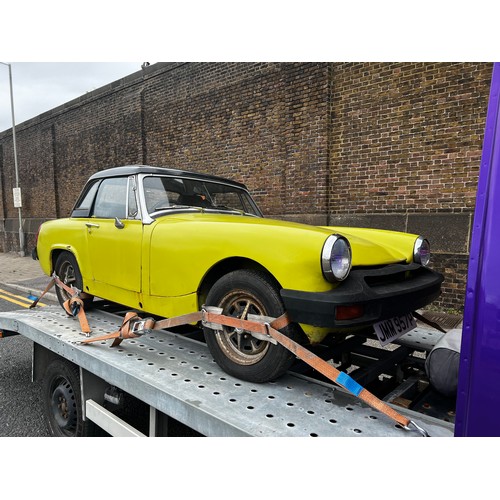 65A - 1975 MG Midget convertible project car in yellow. (No Reserve). Registration JMM957P.
This car runs ... 