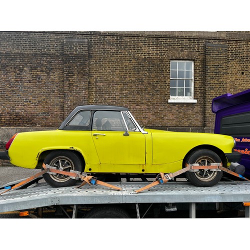 65A - 1975 MG Midget convertible project car in yellow. (No Reserve). Registration JMM957P.
This car runs ... 