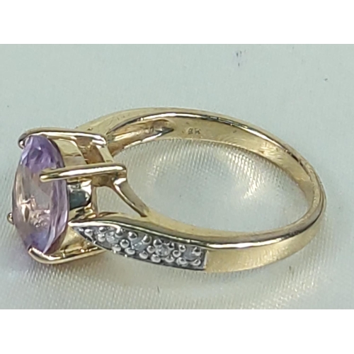 199 - 9ct gold amethyst and diamond ring