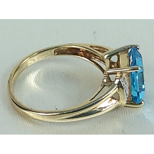 200 - 9ct gold topaz and diamond ring, size M