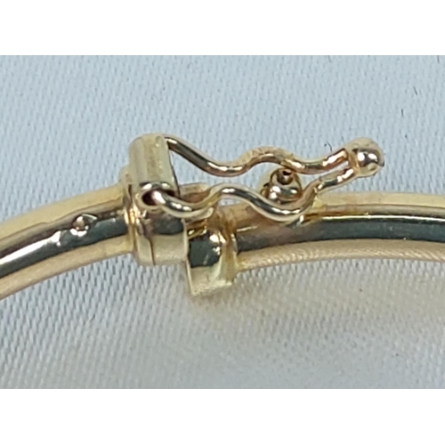 211 - 18ct gold bangle, 5.6g