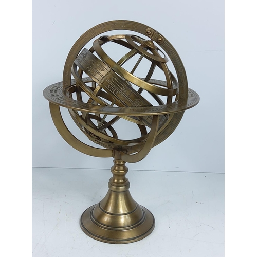 104 - Metal globe figure, 27cms in height