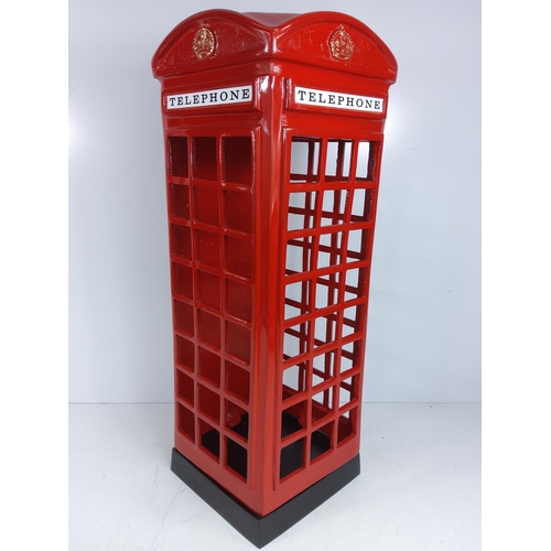 107 - Cast metal telephone box stick stand, 58cms in height