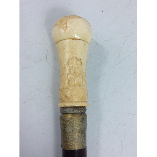 126 - Bone handled walking stick with naked lady figure