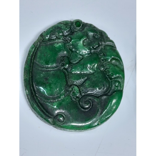 207 - 2 jade green amulets