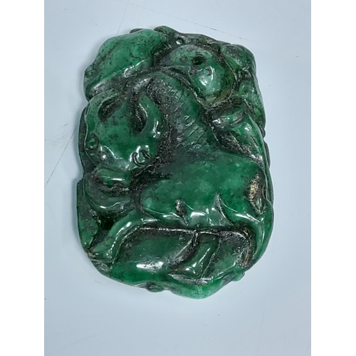 207 - 2 jade green amulets