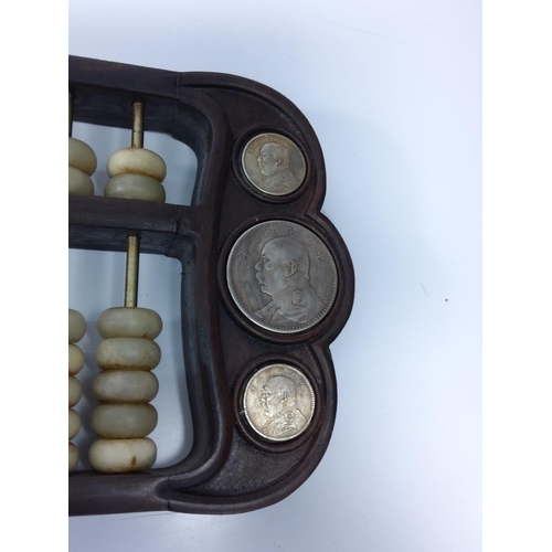 229 - Wood and stone coin set abacus, 42 x 15cms