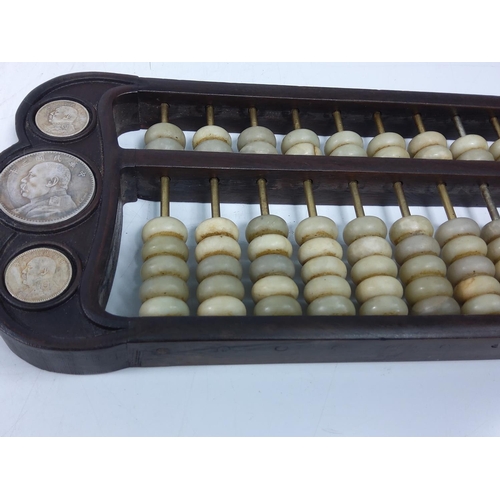 229 - Wood and stone coin set abacus, 42 x 15cms