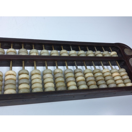 229 - Wood and stone coin set abacus, 42 x 15cms