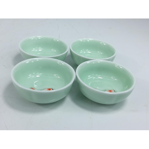 240 - 4 oriental porcelain bowls with swimming koi, 7cms in diameter