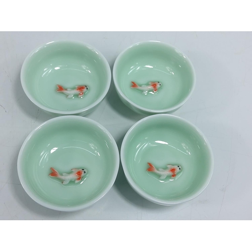 240 - 4 oriental porcelain bowls with swimming koi, 7cms in diameter