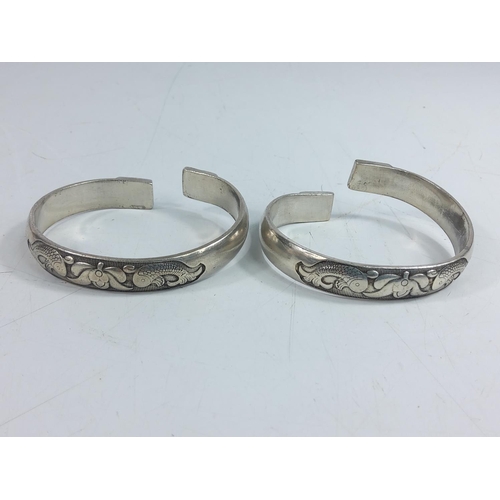 204 - 2 white metal bangles