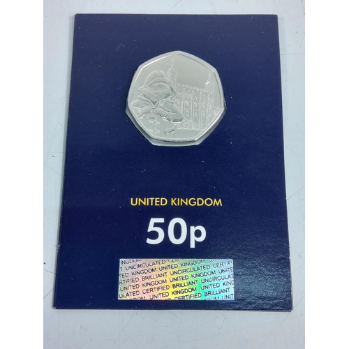 259 - 12 various cased proof 50p pieces