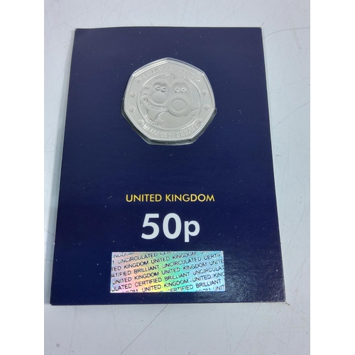 259 - 12 various cased proof 50p pieces