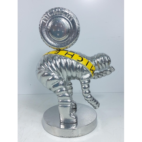 131 - Cast aluminium Michelin man figure, 30cms in height