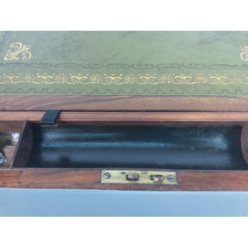 101 - A large antique brass bound writing slope with fitted interior, no key